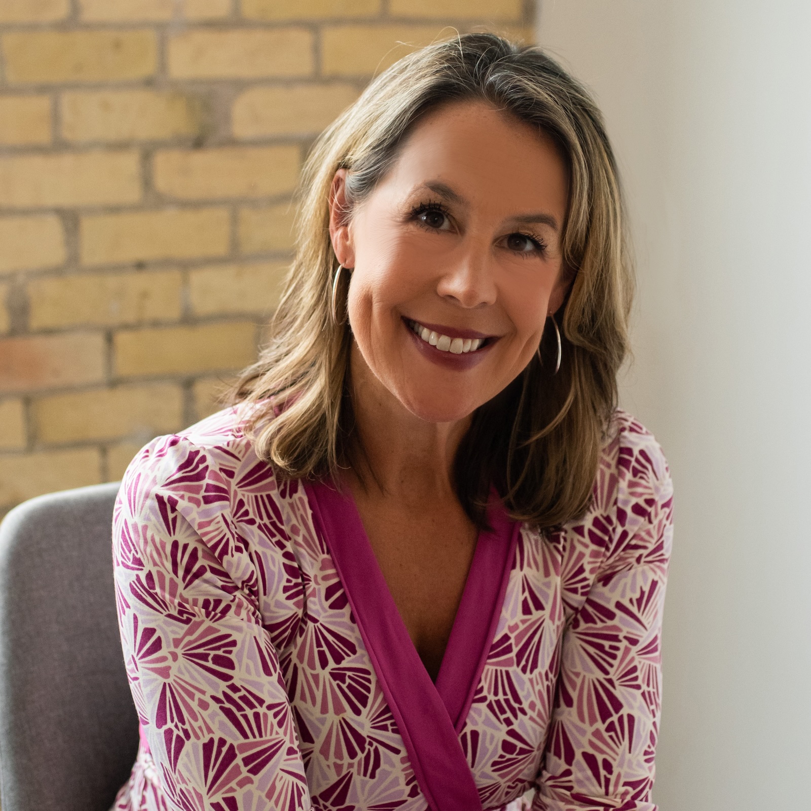 Dr. Karen Doll seated, smiling